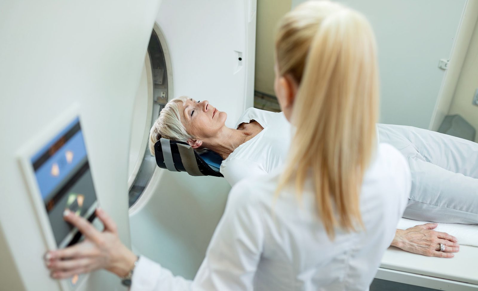 Mature-female-patient-undergoing-for-CT-scan-examination-in-the-hospita-aspect-ratio-1600-975