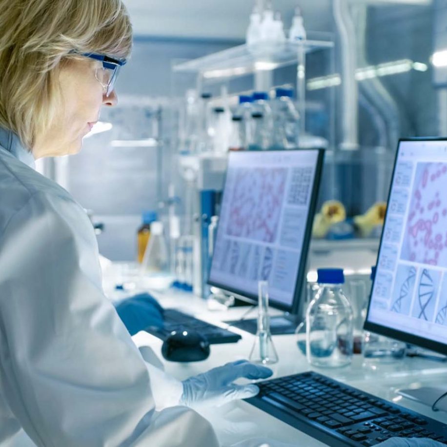 enior-Female-Scientist-Works-On-Computer-in-a-Modern-Laboratory-aspect-ratio-1600-975